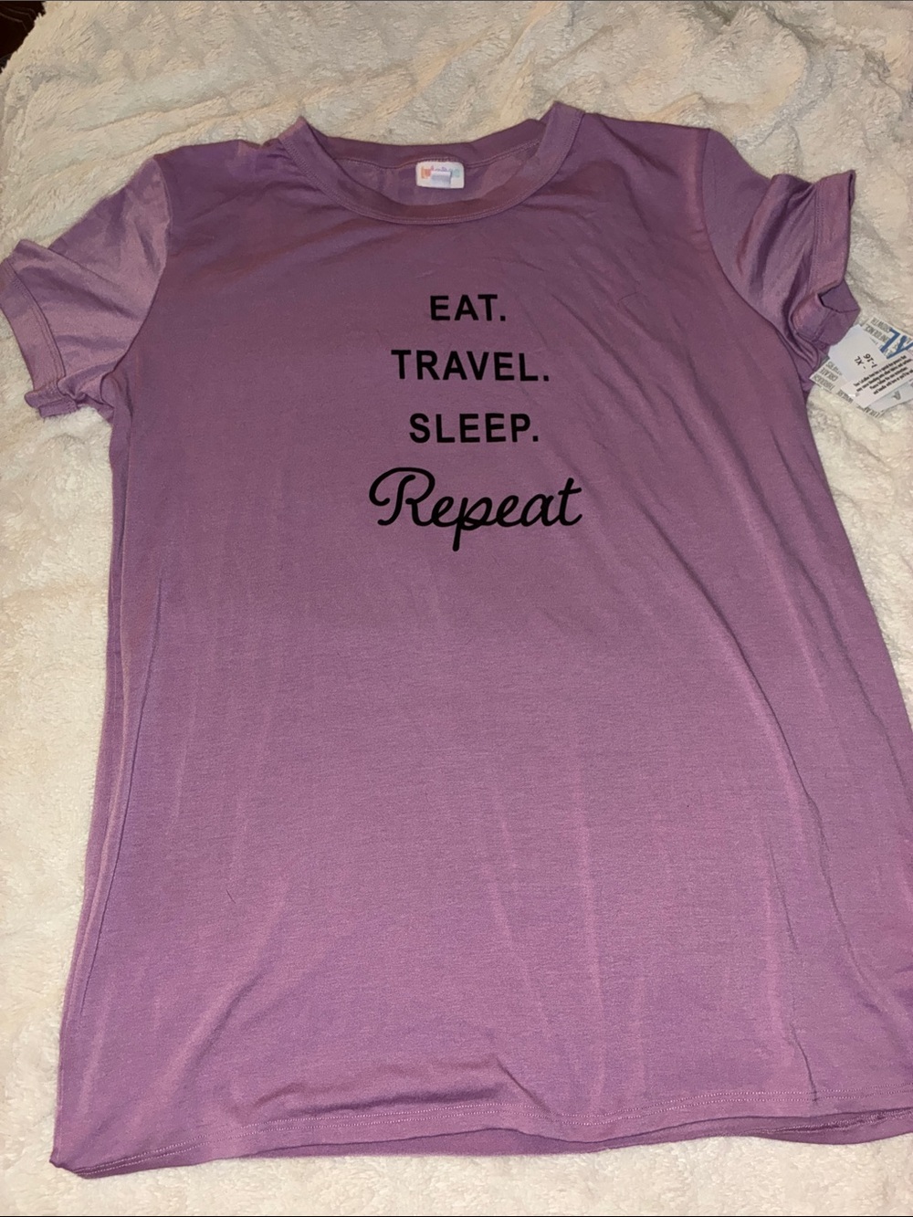 Lavender Graphic Tee - That Reads: Eat, Travel, Sleep, Repeat With Black Text